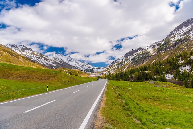 Road amoung snowy Alps mountains Fluelapass Davos Graubuende