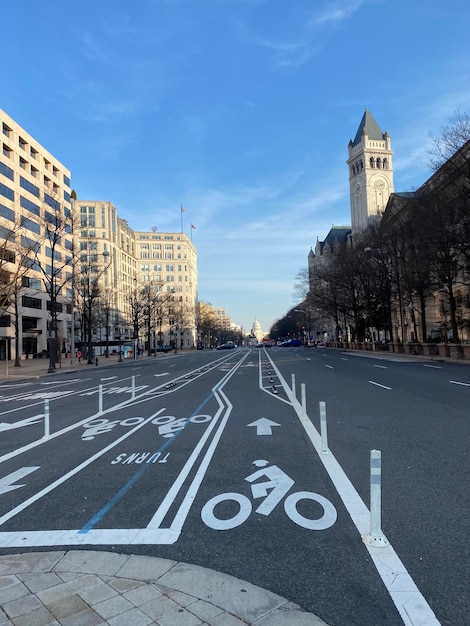 Road by building against sky in city