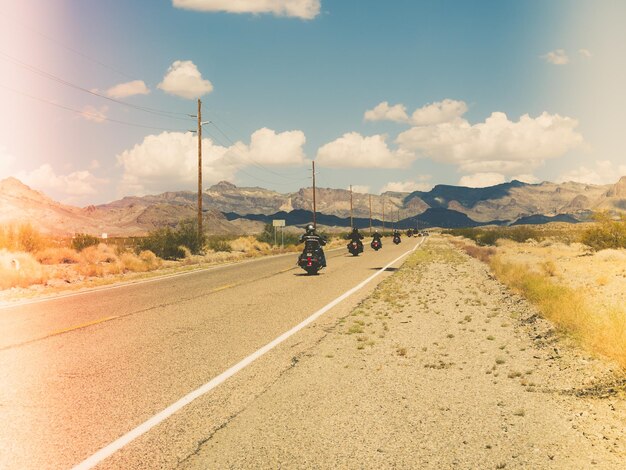 Road by mountain against sky