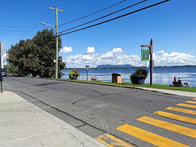 Road by sea against sky in city