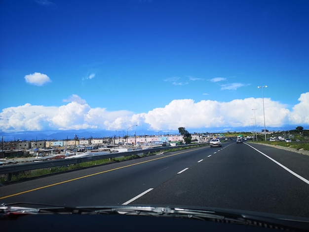 Road in city against sky