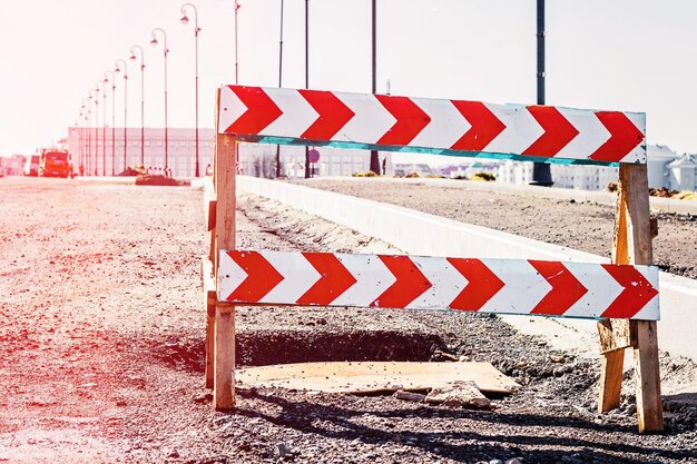 Road closed sign before the road construction. Toned photo