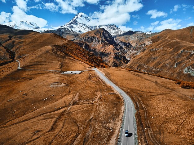 The road to the famous majestic Mount Kazbegi, the third highest peak in Georgia. Greater Caucasus. Stepantsminda, Gergeti