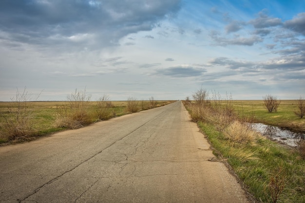 Road in the field the road goes into the distance