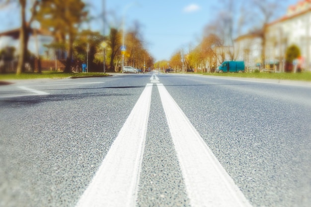 A road going into the distance in the autumn city