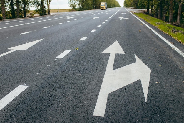 Road lanes with white arrow markings