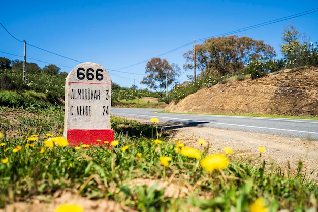 Road milestone indicating 666th kilometer on famous national road n2 going across portugal