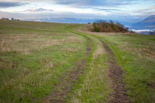 Road in Mountain valley at blue sky