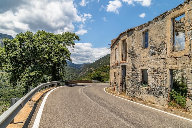 Road in mountains to abandoned old village Gairo Vecchio called Ghost Town Sardinia Italy