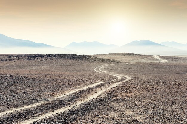 Road to the mountains in the desert on Altiplano plateau, Bolivia