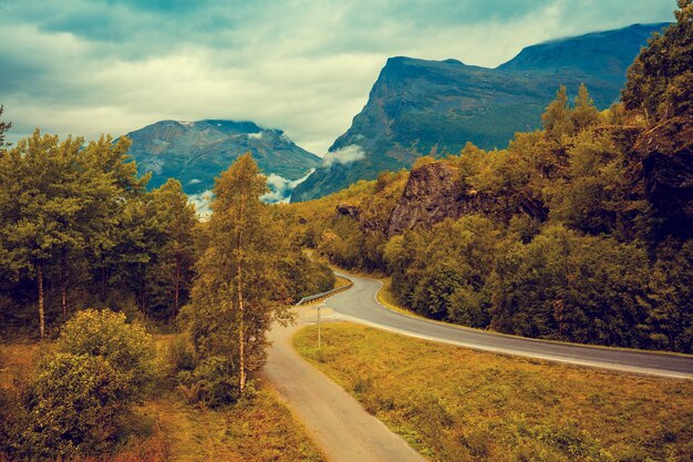 Road among mountains with dramatic stormy cloudy sky mountain landscape Beautiful nature Norway