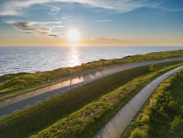 Road near the cliff of the Paldiski peninsula in summer at sunset photo from a drone