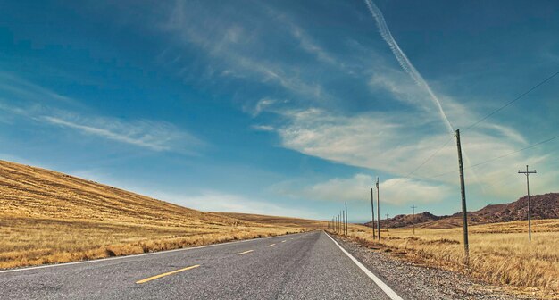 Road passing through Ancash Huaraz Long and empty road surrounded by mountains