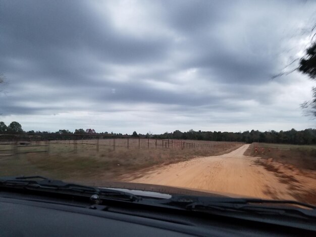 Road passing through landscape against sky