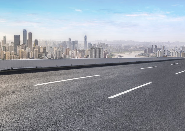 Road pavement and city skyline