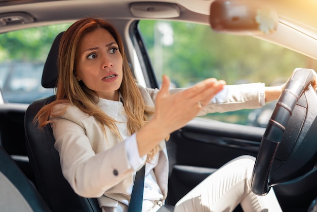 Road rage traffic jam concept. Woman is driving her car very aggressive