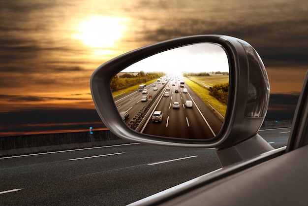 Road in rearview mirror