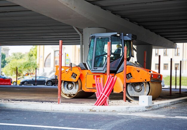 Road roller working at road construction site