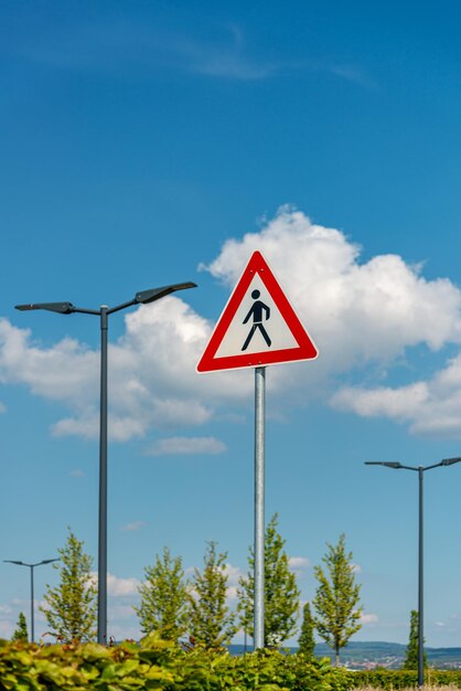 Road sign against sky