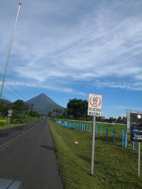 Road sign against sky