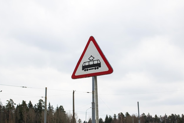 Road sign caution tram on blue sky background