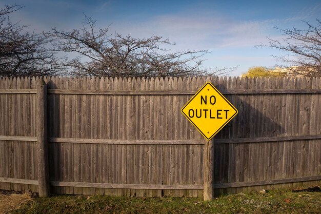 Photo road sign on fence in backyard