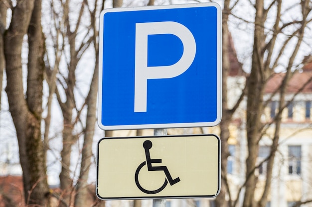 Road sign parking space for disabled people. man in a wheelchair. High quality photo