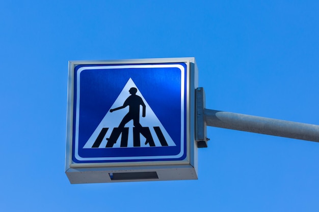 Road sign of a pedestrian crossing