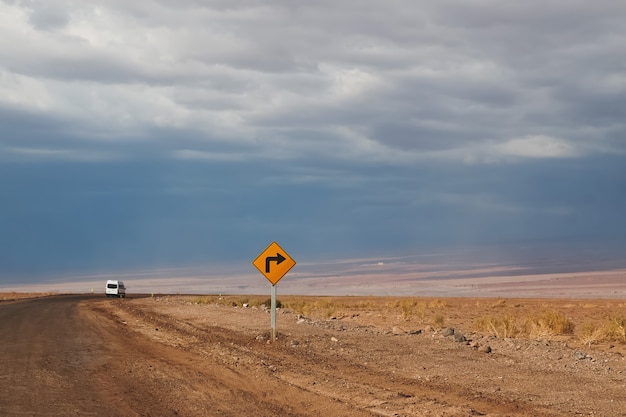 Road sign right turn in desert