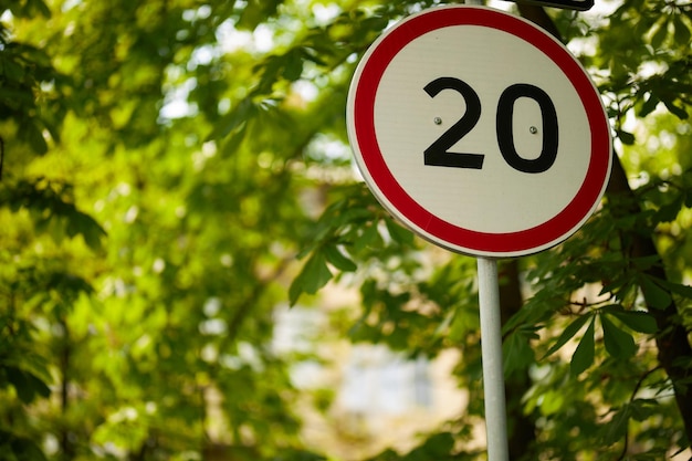 The road sign for the speed limit is 20 kilometers