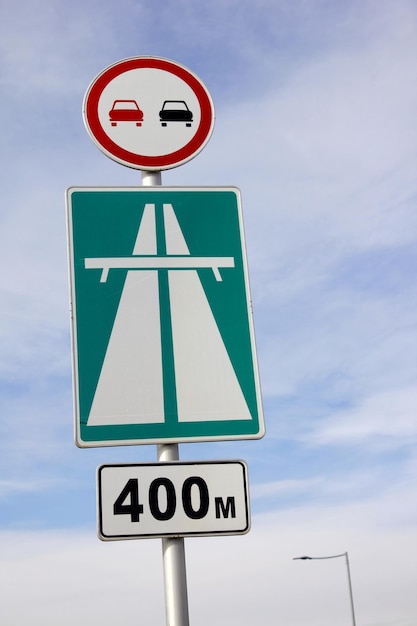 Road sign view against the sky background