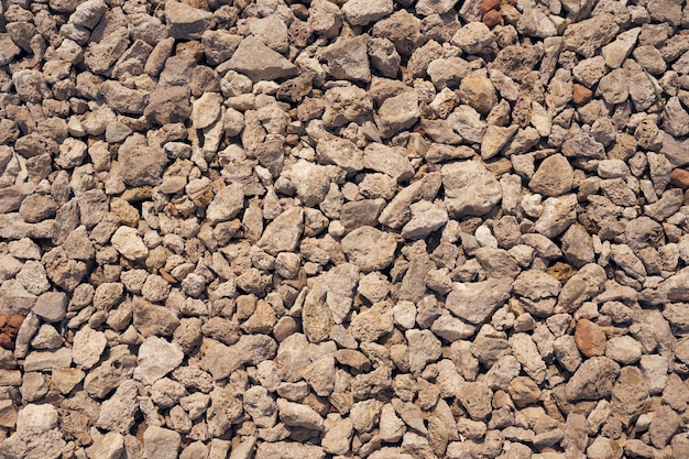 The road strewn with granite rubble as a background.