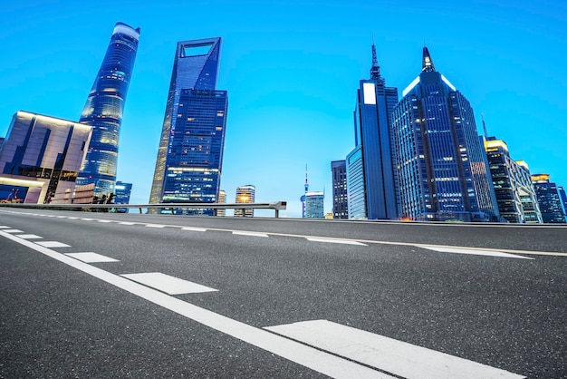 Road surface and urban architectural landscape skyline