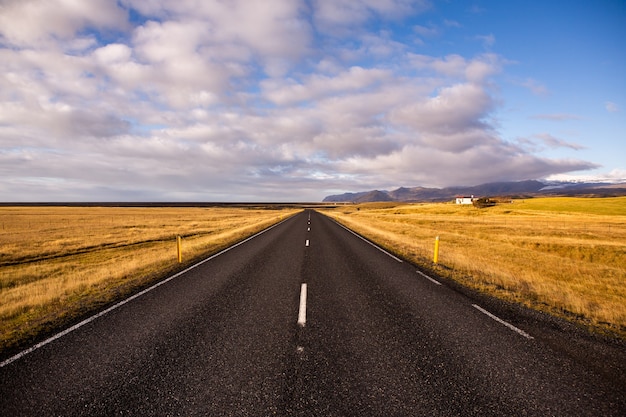 Road through iceland landscape. Road travel concept. Car travel adventure.