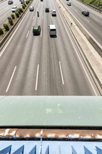 road traffic on a highway seen from an overpass