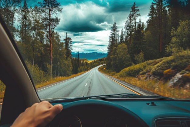 Road trip with windows down in car and long empty road driving