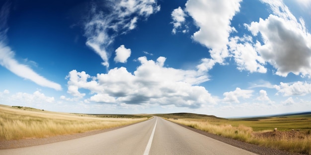 A road with a blue sky and clouds