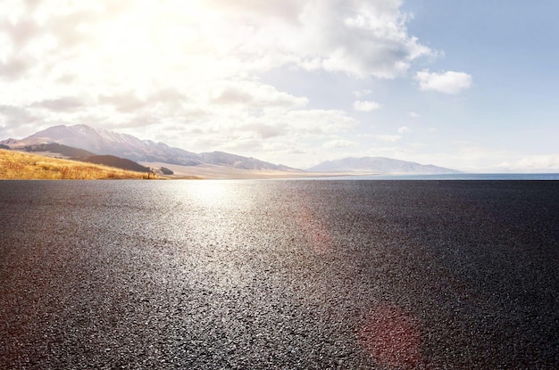 A road with mountains in the background