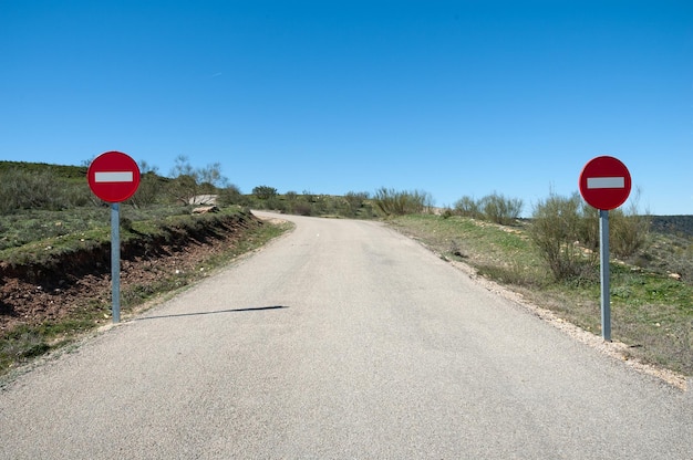 A road with a sign that says no entry on it