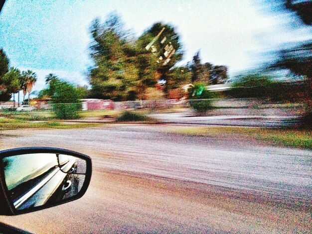 Photo road with trees in background