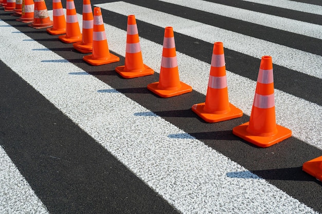 Road Works Cone Construction Cone Red Plastic Warning Sign Road Witches' Hat Channelizing Cone on Street Safety Traffic Many Road Cones on a Pedestrian Crossing