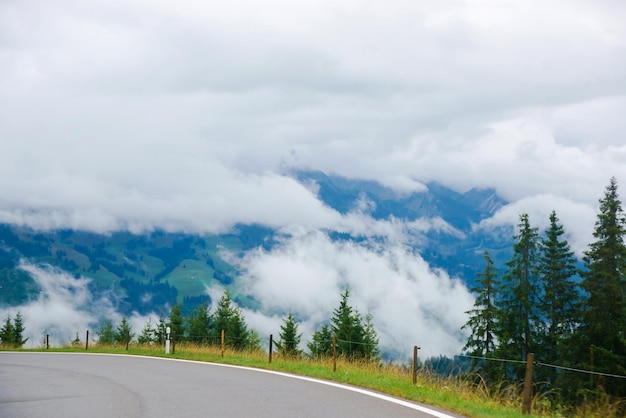 Roadway at the village of Boltigen with Swiss Alps at Jaun Pass in Fribourg canton in Switzerland.