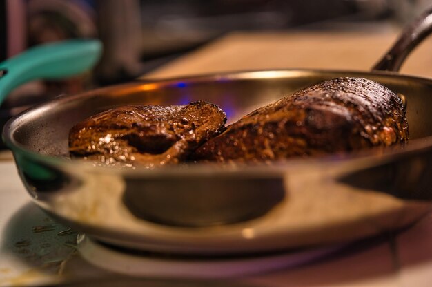 Photo roast beef baked in a silver frying pan