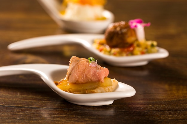 Roast beef, grilled pineapple, macauba and basil flower in a spoon