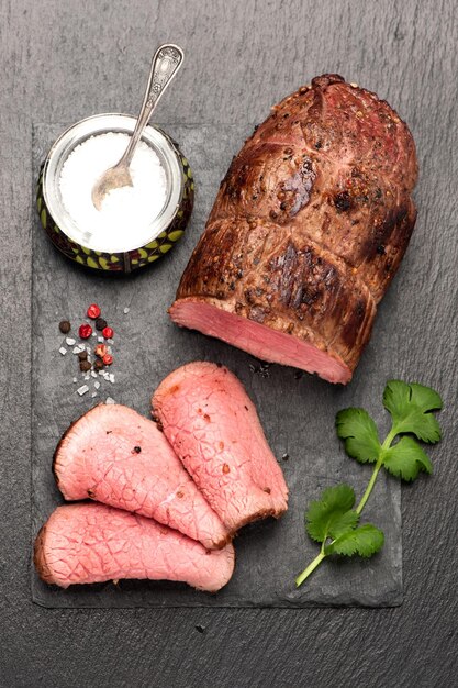 Roast beef on a stone background