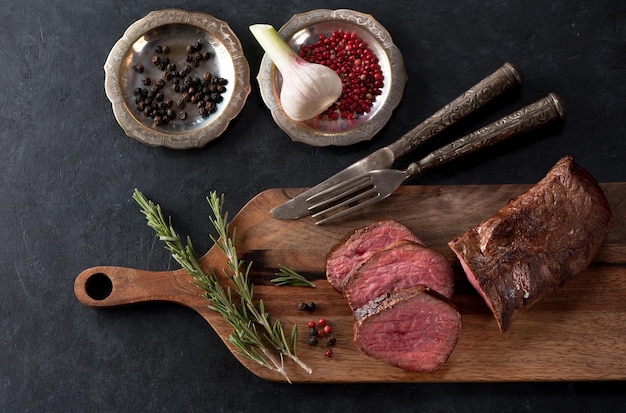 Roast beef on a wooden cutting board