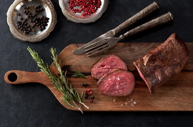 Roast beef on a wooden cutting board