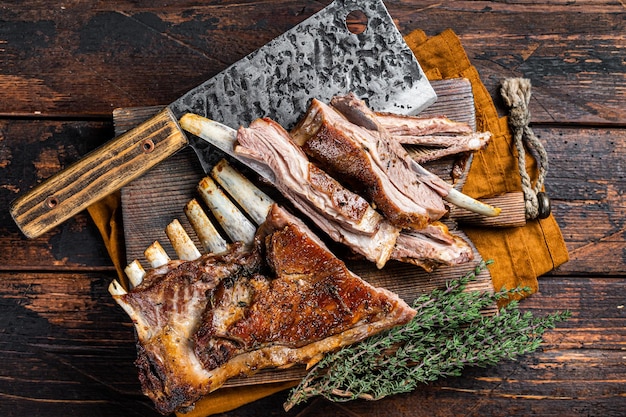 Roast lamb ribs mutton spareribs sliced meat on wooden board Wooden background Top view