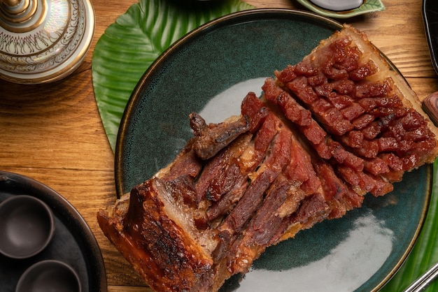 Roast pork grilled with crispy pork skin ready to eat