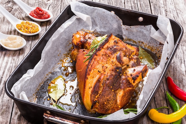 Roast pork knuckle in a baking dish